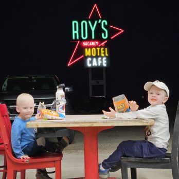 Roy's Motel & Cafe - Kiddos eating snacks from the convenience store. - Gas Stations Near Me - Amboy, California