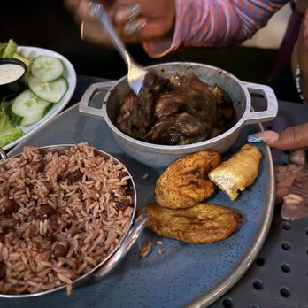 Kekoon Restaurant & Lounge - Oxtail meal with sweet plantain and rice and peas. - Bars Near Me - Davie, Florida