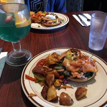 Mimosas Cafe - Blue curaçao mimosa in front, soursop mimosa behind, and ONE smoked salmon Benedict split for two - Breakfast & Brunch Near Me - San Jose, California