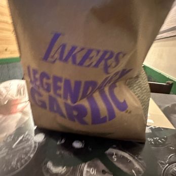 Wingstop - a bag of food sitting on a table - Chicken Wings Near Me - Moreno Valley, California