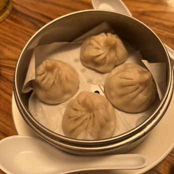 The Joy Luck - Soup dumplings. Eat it in the spoon. They leak and are super hot (temp), but so delicious! - Taiwanese Near Me - Louisville, Kentucky