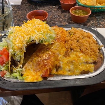 Ponak's Mexican Kitchen - This is the #2 dinner, no pun intended. It has a burrito, taco, tostada, rice, and refried beans. - Mexican Near Me - Kansas City, Missouri Ponak's Mexican Kitchen - This is the #2 dinner, no pun intended. It has a burrito, taco, tostada, rice, and refried beans. - Mexican Near Me - Kansas City, Missouri
