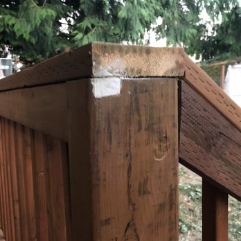 Marcus Construction & Development - a close up of a wooden railing - General Contractors Near Me