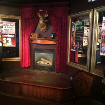 Cavan Irish Pub - The Stage and Fireplace with the Notorious Drinking Deer - Gay Bars Near Me - Columbus, Ohio Cavan Irish Pub - The Stage and Fireplace with the Notorious Drinking Deer - Gay Bars Near Me - Columbus, Ohio