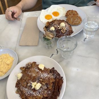 Breakfast by Salt’s Cure - walnut banana pancakes & scrambled eggs in front of - Breakfast & Brunch Near Me - Brooklyn, New York