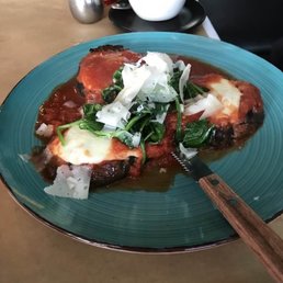 EGGPLANT PARMIGANA Baked with Asiago & Mozzarella, Served on a bed of San Marzano Sugo EGGPLANT PARMIGANA Baked with Asiago & Mozzarella, Served on a bed of San Marzano Sugo