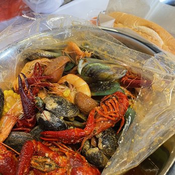 The Crawfish Hut - Combo 1 in Mango Tango sauce. Added on green mussels, sausages and a Viet baguette - Seafood Near Me - Burien, Washington The Crawfish Hut - Combo 1 in Mango Tango sauce. Added on green mussels, sausages and a Viet baguette - Seafood Near Me - Burien, Washington