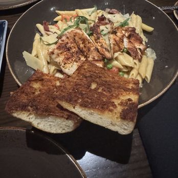 Reunion Kitchen + Drink - Crispy pancetta pasta. Slightly blackened chicken. The best Parmesan garlic bread. - New American Near Me - Anaheim, California Reunion Kitchen + Drink - Crispy pancetta pasta. Slightly blackened chicken. The best Parmesan garlic bread. - New American Near Me - Anaheim, California