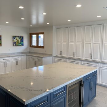 Heller Construction - a kitchen with white cabinets and marble countertops - General Contractors Near Me - San Diego, California Heller Construction - a kitchen with white cabinets and marble countertops - General Contractors Near Me - San Diego, California