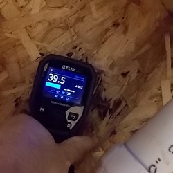 Superior Inspection Services - Moisture meter confirming water has penetrated below a shower.