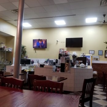 Gorée Cuisine - Register area with tv on YouTube videos. - Senegalese Near Me - Chicago, Illinois Gorée Cuisine - Register area with tv on YouTube videos. - Senegalese Near Me - Chicago, Illinois