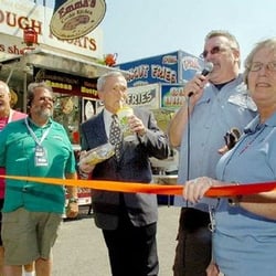 Three Rivers Festival - Mayor Tom Henry drinks a lemon shake-up as he is introduced by Jack Hammer, Friday's ribbon-cutting ceremony