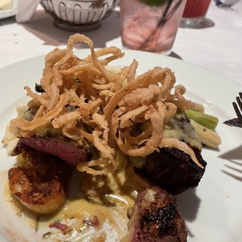 Lindey's - Beef Medallions with bernaise sauce, asparagus, mashed potatoes & topped w/ff onion strings - New American Near Me - Columbus, Ohio Lindey's - Beef Medallions with bernaise sauce, asparagus, mashed potatoes & topped w/ff onion strings - New American Near Me - Columbus, Ohio