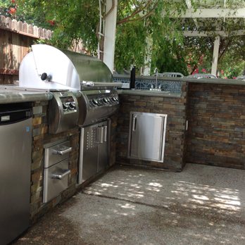 Ayala Western Panoramics - Outdoor kitchen, Polished Concrete countertops and stacked Stone on the walls. - Landscaping Near Me Ayala Western Panoramics - Outdoor kitchen, Polished Concrete countertops and stacked Stone on the walls. - Landscaping Near Me