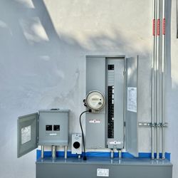 Evergreen Solar and Home Battery - See how the gutter (the rectangular electrical box at the bottom) lines up to the left with the solar inverter sub-panel at the left.