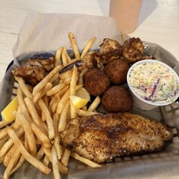 The Duo - Blackened catfish & Shrimp With sides of hushpuppies, slaw & house fries The Duo - Blackened catfish & Shrimp With sides of hushpuppies, slaw & house fries