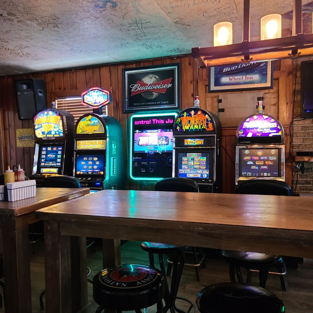 Wheel Inn Tavern - a row of slot machines - Bars Near Me - Lincoln, Montana Wheel Inn Tavern - a row of slot machines - Bars Near Me - Lincoln, Montana