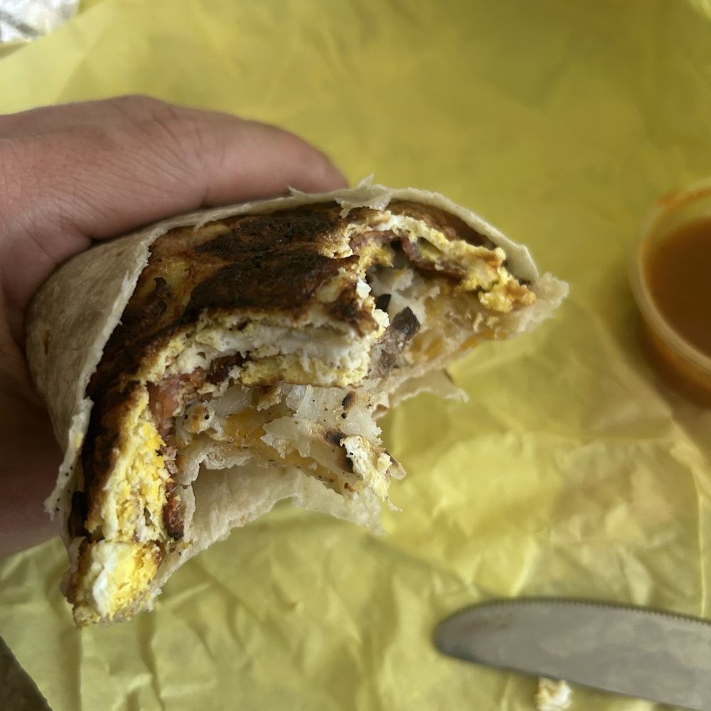 Breakfast burrito, that is burnt egg not the tortilla Breakfast burrito, that is burnt egg not the tortilla