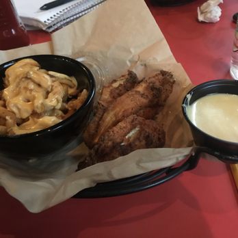 Boylan Heights - Salty chicken tenders with cheese curly fries - Burgers Near Me - Charlottesville, Virginia Boylan Heights - Salty chicken tenders with cheese curly fries - Burgers Near Me - Charlottesville, Virginia
