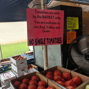 Veggie Patch - a display of tomatoes at a farmer's market - Fruits & Veggies Near Me - Newnan, Georgia