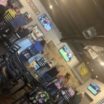 Rock Canyon Cider - a woman sitting at a bar - Beer Bar Near Me - Tijeras, New Mexico Rock Canyon Cider - a woman sitting at a bar - Beer Bar Near Me - Tijeras, New Mexico