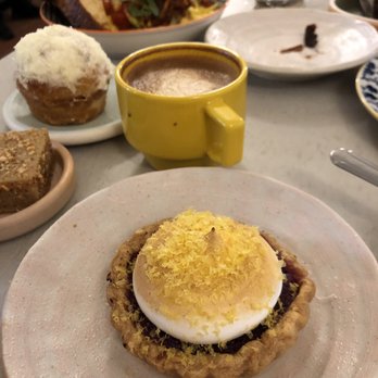 Breadbelly - Ube tart, Cappuccino, ham and cheese ensaymada and brown butter mochi in the background - Bakeries Near Me - San Francisco, California Breadbelly - Ube tart, Cappuccino, ham and cheese ensaymada and brown butter mochi in the background - Bakeries Near Me - San Francisco, California
