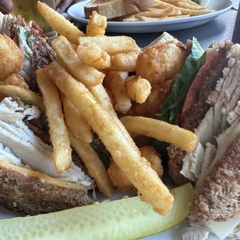 Doogers Seafood & Grill - Sandwich w/ half fries, half tots and comes with a pickle. These common fries aren't my fave (greasy) but the rest was amazing - Seafood Near Me - Seaside, Oregon