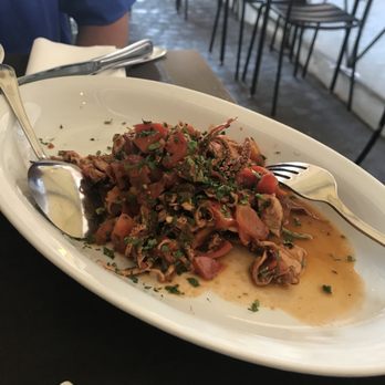 Melarancio - Calamari in tomatoes - Wine Bars Near Me - Rome, RM Melarancio - Calamari in tomatoes - Wine Bars Near Me - Rome, RM