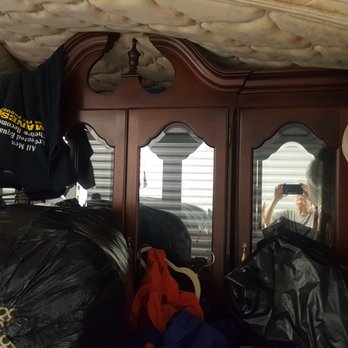 American Movers - Mattress on top of delicate china cabinet carvings. Part of couch on top of cabinet edge. Clothes strewn everywhere. - Movers Near Me - Wichita, Kansas