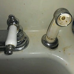 This faucet was leaking, and rusting out. Replaced with new delta faucet. 4/1/13.