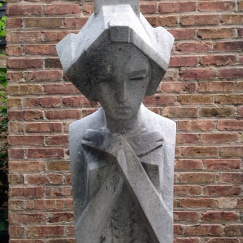 Frank Lloyd Wright Home and Studio - Stone sculpture " accent sprite" in the garden below the ginkgo tree. - Museums Near Me - Oak Park, Illinois