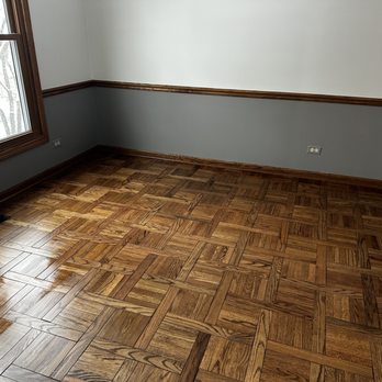 Plamada Flooring - a hardwood floor in an empty room - Flooring Near Me