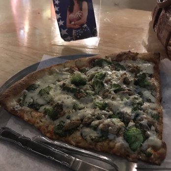 Fellini's Pizza - White Pizza with broccoli and sausage - Pizza Near Me - Atlanta, Georgia Fellini's Pizza - White Pizza with broccoli and sausage - Pizza Near Me - Atlanta, Georgia