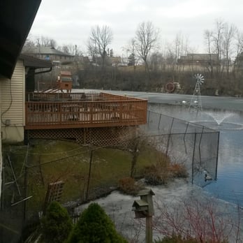 Julie's Cafe and Catering - Pond with peacocks and peacock houses - American Near Me - Green Bay, Wisconsin