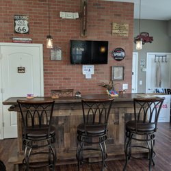 The Man Cave Haircuts - Have a seat a the bar with a free beer!