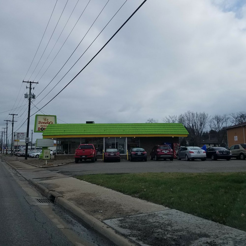 Look for green topped building.