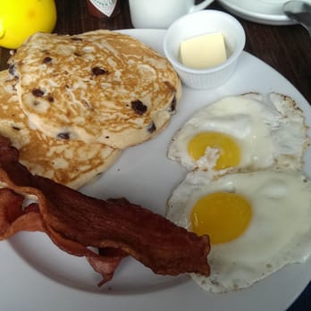 Cheeky Cafe - Chocolate chip pancakes with sunny side eggs and bacon - Asian Fusion Near Me - Seattle, Washington Cheeky Cafe - Chocolate chip pancakes with sunny side eggs and bacon - Asian Fusion Near Me - Seattle, Washington