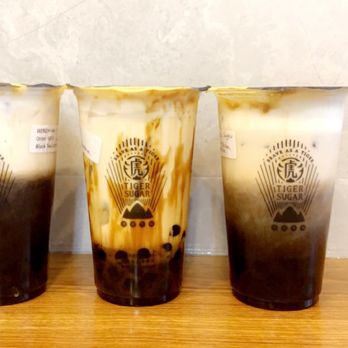 Tiger Sugar - Brown sugar black tea lattes with cream mousse on the sides, middle: brown sugar milk with cream mousse - Bubble Tea Near Me - New York, New York Tiger Sugar - Brown sugar black tea lattes with cream mousse on the sides, middle: brown sugar milk with cream mousse - Bubble Tea Near Me - New York, New York