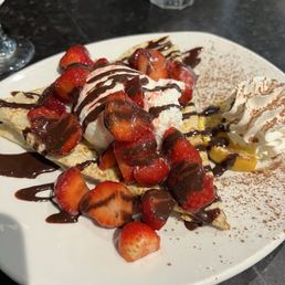 Delightful strawberry dessert crepe. Delightful strawberry dessert crepe.