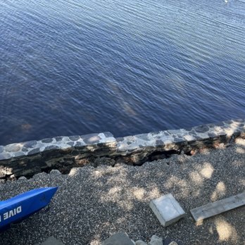 Franky Stonewalls and Construction - Just more photos of the wall leaning further into the water - General Contractors Near Me - Montgomery, New York
