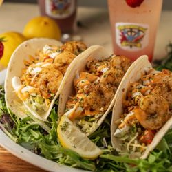Mighty Good Seafood - Flavor-packed shrimp/fish/chicken tacos loaded with seasoned, fresh toppings, and signature sauce for the perfect bite every time.