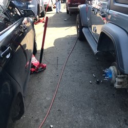 Pacheco's Tire Service - Working on my back tire.