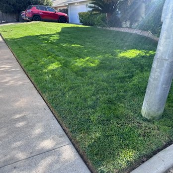Diaz and Flores Landscape Maintenence - a red car parked in the driveway - Irrigation Near Me