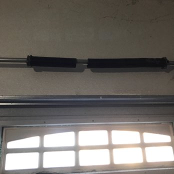 Atlas Overhead Doors - Mr. Fregoso hard at work replacing a broken spring. - Garage Door Services Near Me Atlas Overhead Doors - Mr. Fregoso hard at work replacing a broken spring. - Garage Door Services Near Me