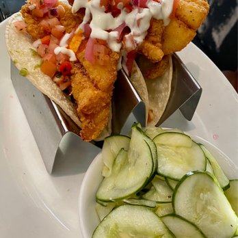 Burtons Grill & Bar - FISH TACOS   fried haddock, guacamole, pickled red onion, tomato jalapeño relish, crema, hot sauce, cucumber salad - New American Near Me - Framingham, Massachusetts