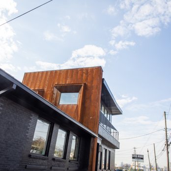 Ochoa Bros - a brick building with a metal roof - General Contractors Near Me - Nashville, Tennessee Ochoa Bros - a brick building with a metal roof - General Contractors Near Me - Nashville, Tennessee
