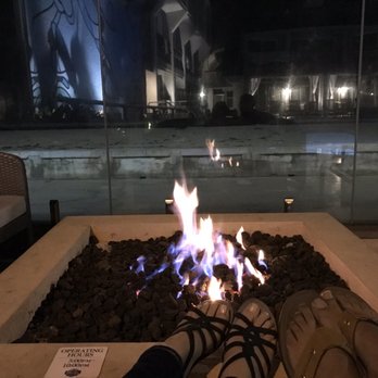 The Wayfarer San Diego - My husband and I enjoying the warm fire by the pool area. The ocean is right in front of you. - San Diego, CA