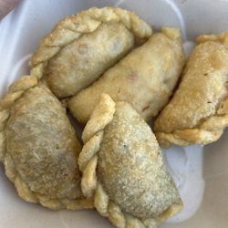 Nina's Cafe - Chicken empanadas at top.  Beef at the bottom. Both come with sauce.