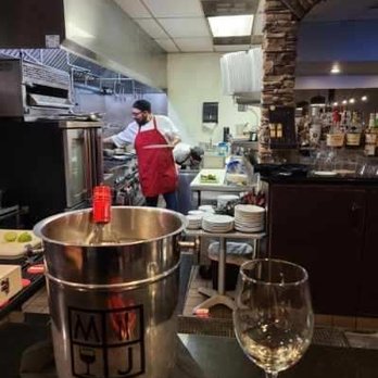 M & J Bistro - Kitchen from the bar.  Watch while they cook. - New American Near Me - Tracy, California