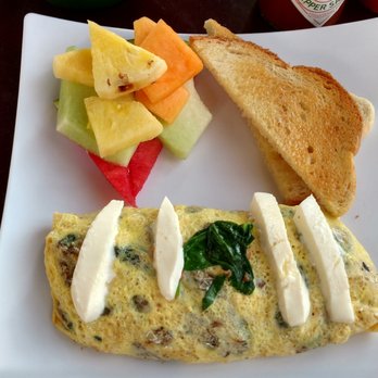 Park Cafe - Spinach omelet. Filling includes bacon, mushrooms and caramelized onions. - American Near Me - Litchfield Park, Arizona Park Cafe - Spinach omelet. Filling includes bacon, mushrooms and caramelized onions. - American Near Me - Litchfield Park, Arizona